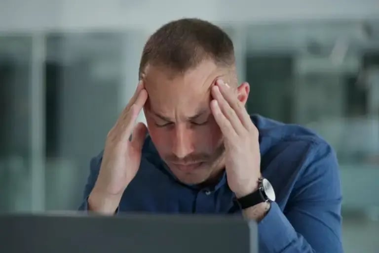 Stressed Man at Desk